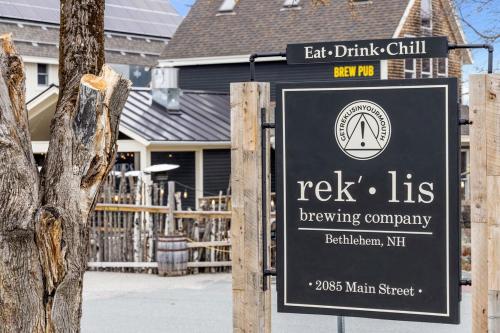 a sign for ack its brewing company in front of a house at Cozy 3BR Retreat in Downtown Bethlehem - Hot Tub, Trails, Near Ski & Hike in Bethlehem