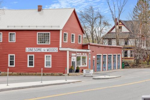 a red building on the side of a street at Cozy 3BR Retreat in Downtown Bethlehem - Hot Tub, Trails, Near Ski & Hike in Bethlehem