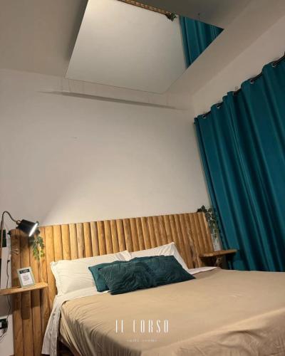 Postel nebo postele na pokoji v ubytování Il corso suite rooms