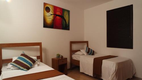 Posteľ alebo postele v izbe v ubytovaní Havanna