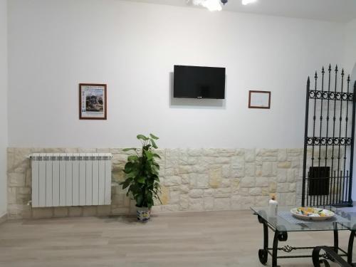 TV o dispositivi per l'intrattenimento presso Bed And Breakfast Polizzi House