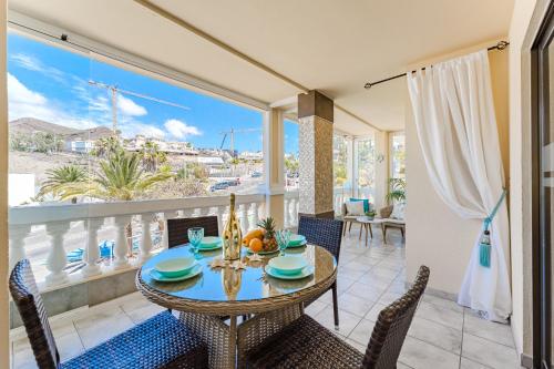 a dining room with a table and chairs at Ocean Terrace Apartment in Los Cristianos