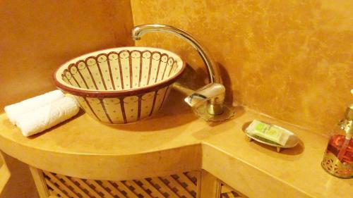a sink in a bathroom with a faucet at Riad Sabah in Fès