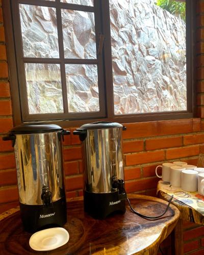 two blenders sitting on a table next to a window at The Lookout Hideaway in Baños