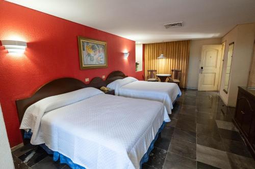 Postel nebo postele na pokoji v ubytování Hotel Tapachula