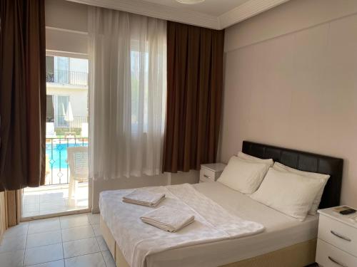 Postel nebo postele na pokoji v ubytování Cam Hotel
