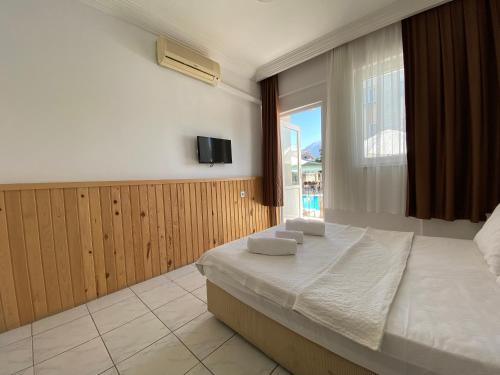 Postel nebo postele na pokoji v ubytování Cam Hotel