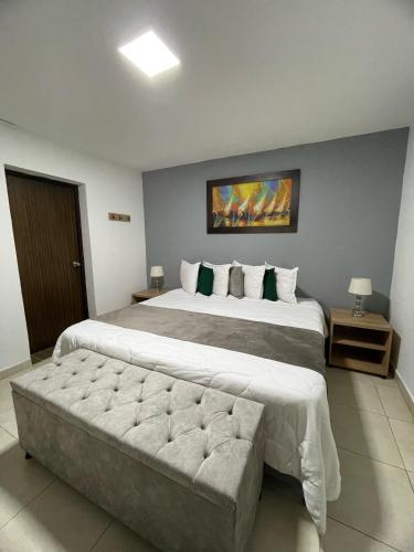 Ένα ή περισσότερα κρεβάτια σε δωμάτιο στο Aguacatala Hotel Boutique