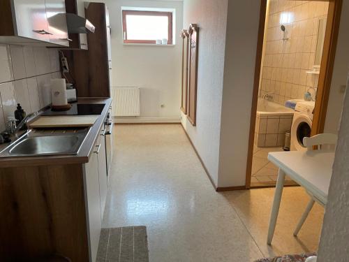 a small kitchen with a sink and a counter top at Drei Linden Stadtmarkt in Wolfenbüttel