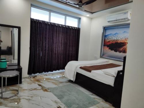 Krevet ili kreveti u jedinici u okviru objekta Rivaidhii inn rooms