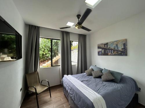 Una cama o camas en una habitación de Villa Los Pinos