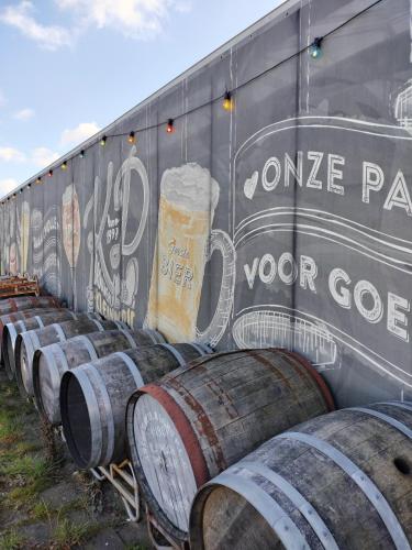 a train car with a bunch of barrels of beer at Blom studio's in Hillegom