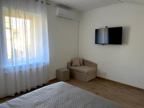 Μια τηλεόραση ή/και κέντρο ψυχαγωγίας στο Feel Comfy Apartment