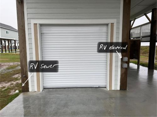 a garage door with a rv service sign on it at Jelly Bay in Bolivar Peninsula