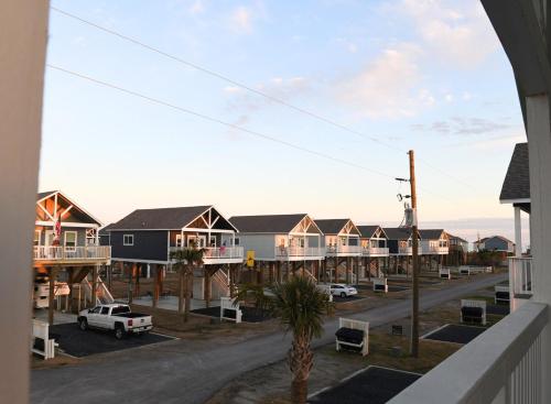 arial view of a town with houses and a street at Jelly Bay in Bolivar Peninsula