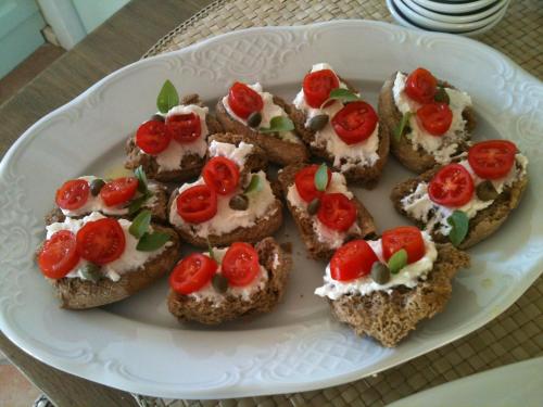 a white plate with a bunch of food on it at Ktima Noosfera Wellness & Retreat Center in Nees Vrisoules