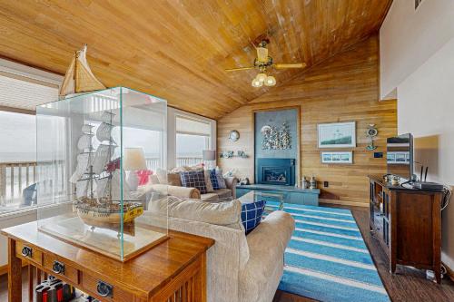 a living room with a couch and a table at At The Seaside in Lincoln Beach