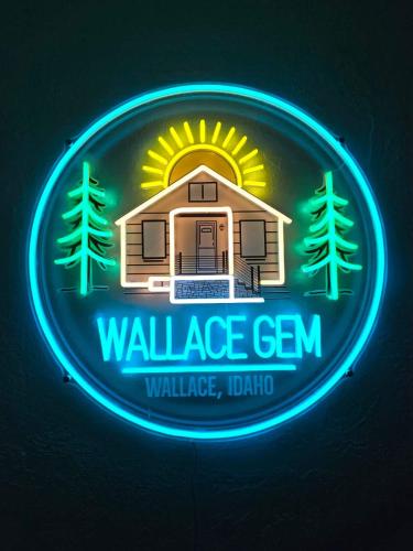 a neon sign of a wellness gym with a house at Close to Hiawatha Tr and Biking with HOT TUB in Wallace