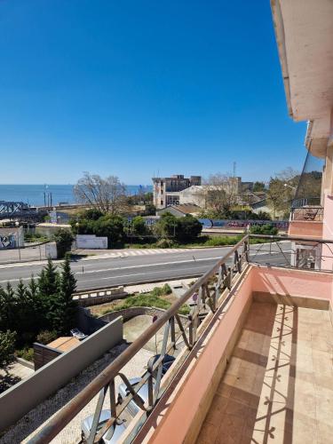 a view of a street from a balcony of a building at Riverfront 2 Bedrooms with Balcony in Cruz Quebrada