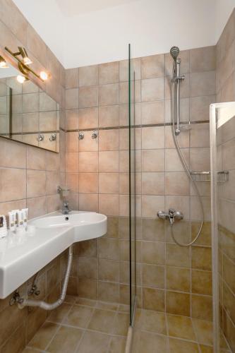 a bathroom with a sink and a shower at Viros Holiday House Breathtaking Views & Private Mini Pool Jacuzzi in Corfu in Virós