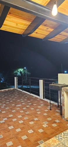 a balcony with a table and a view of the ocean at cabaña el huricho in Mazamitla
