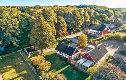 an aerial view of a home with a red barn at Amazing Home In Munka-Ljungby With Wifi in Munka-Ljungby