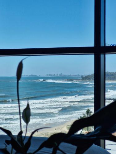a view of the ocean from a room with a window at Luxury Beachside Apartment - The Hemingway in Gold Coast