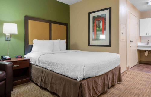 a bedroom with a large bed in a hotel room at Extended Stay America Suites - Fort Worth - Medical Center in Fort Worth