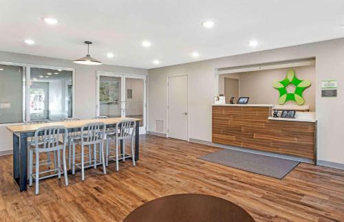a large room with a bar with stools at Extended Stay America Suites - Tampa - Casino Area in Tampa