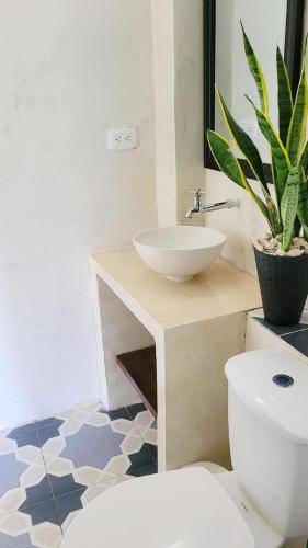a bathroom with a sink and a toilet at Studio apartment in the mountains in Santa Marta