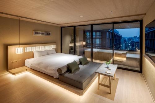 Postel nebo postele na pokoji v ubytování MOKU Kyoto