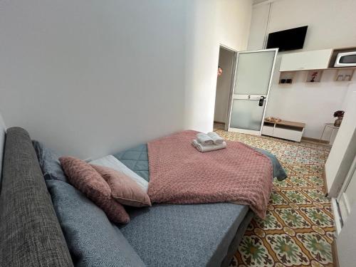 Katil atau katil-katil dalam bilik di CozyNest B&B - Cettina
