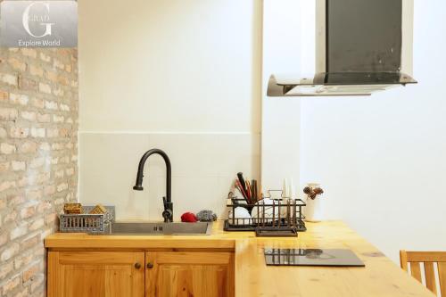 a kitchen with a sink and a counter at Hoang Yen Villa & Coffee in Da Lat