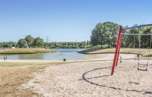 a beach with a volley ball net in the sand at Buitengoed Het Lageveld - 58 in Hoge-Hexel