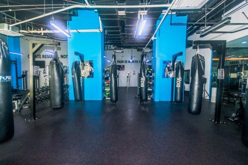 a gym with lots of tires in a room at Air Residence Penthouse 59 Suite Gym Swim Park 300 mbps in Manila
