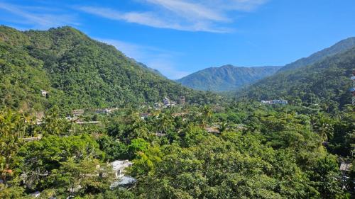 an aerial view of a valley in the mountains at Casa Mismaloya Selva in Cedro