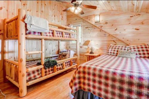 a bedroom with two bunk beds in a cabin at 489OER in Whitefield