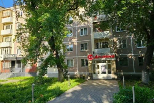 a building with a sign in front of it at 2х комнатная квартира в центре in Ustʼ-Kamenogorsk