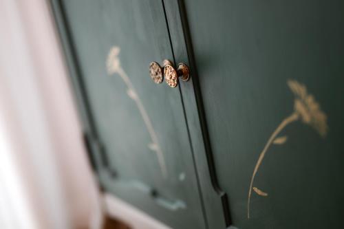 a butterfly on the door of a room at Tweet Apartments with Sauna and optional Breakfast Close To Terme Sveti Martin in Štrigova