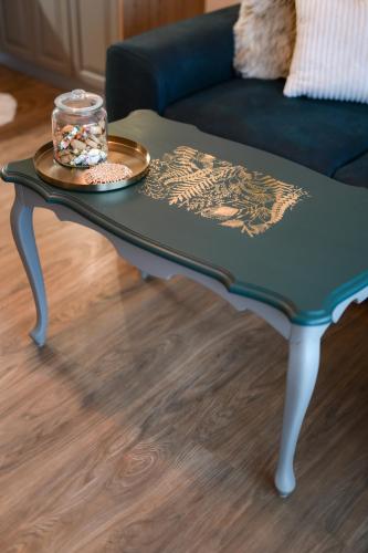 a coffee table with a plate on top of it at Tweet Apartments with Sauna and optional Breakfast Close To Terme Sveti Martin in Štrigova