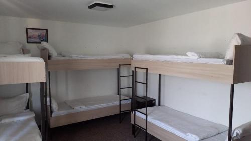 a group of bunk beds in a room at Hostel Tanzharyk in Aktobe