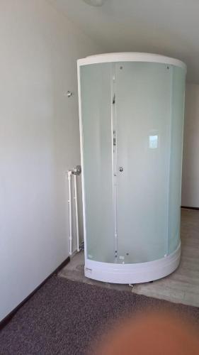 a room with a white cabinet in the corner of a room at Hostel Tanzharyk in Aktobe