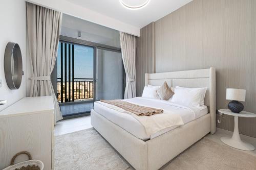 a bedroom with a bed and a large window at Legacy by Sunrise - Top Amenities and Paddle Court in Dubai