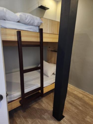 a couple of bunk beds in a room at YES Guesthouse in Angeles