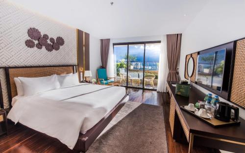 Ένα ή περισσότερα κρεβάτια σε δωμάτιο στο KK Sapa Hotel