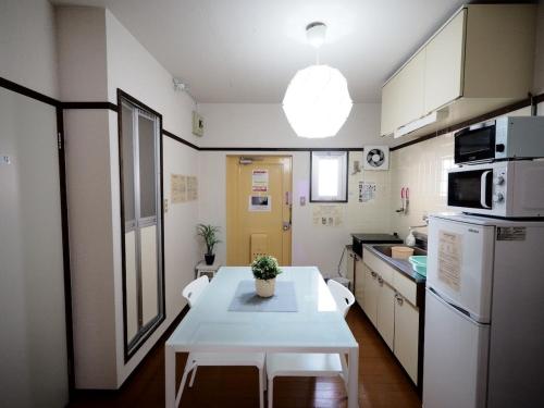 Kuchyň nebo kuchyňský kout v ubytování Living CUBE Beppu Station