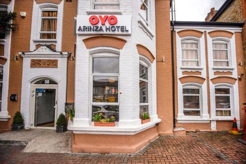 aeyesarma hut is on the side of a building at Arinza Hotel, London Ilford in Ilford