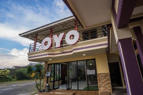 a sign on the side of a building at Hotel O Central Batu Near Jatim Park 3 Formerly Bunga Matahari Hotel in Batu