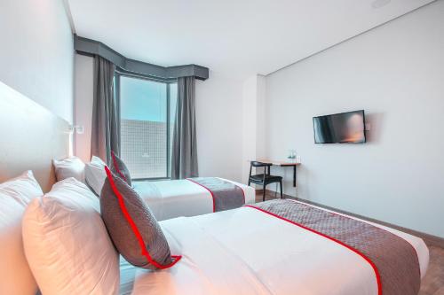 Postel nebo postele na pokoji v ubytování Super OYO Townhouse 1 Hotel Salemba