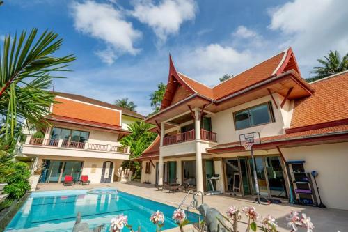 an image of a house with a swimming pool at Kata Sea Cloud Villa半山海景独栋别墅 in Kata Beach